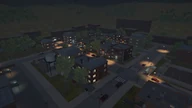 The district at night from above, with the water tower on the left.