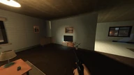 A furnished apartment room with a television and a lamp, pistol drawn in the foreground.